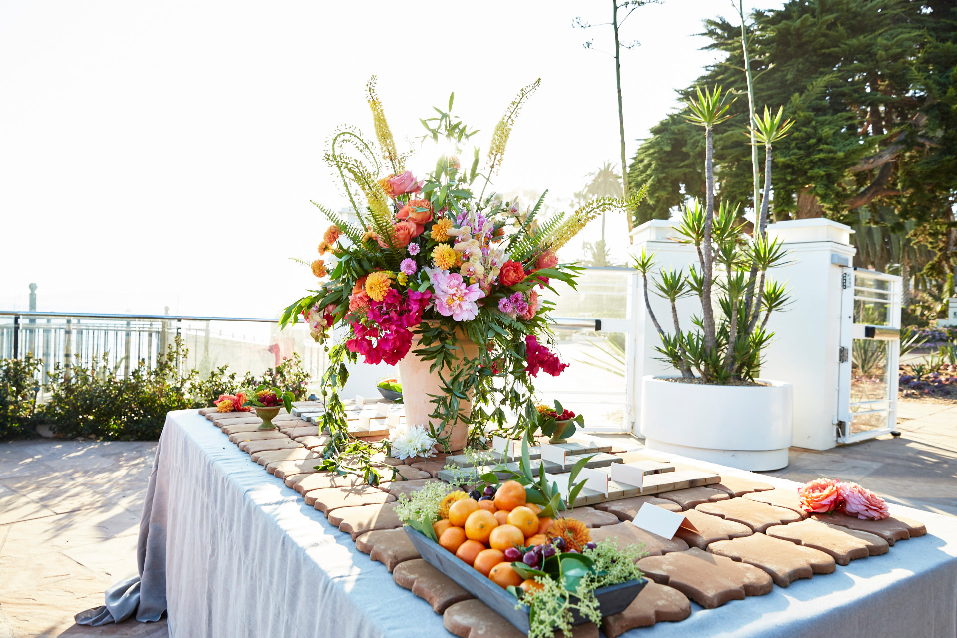 Vibrant floral arrangement on a wedding welcome table at Four Seasons Biltmore Santa Barbara
